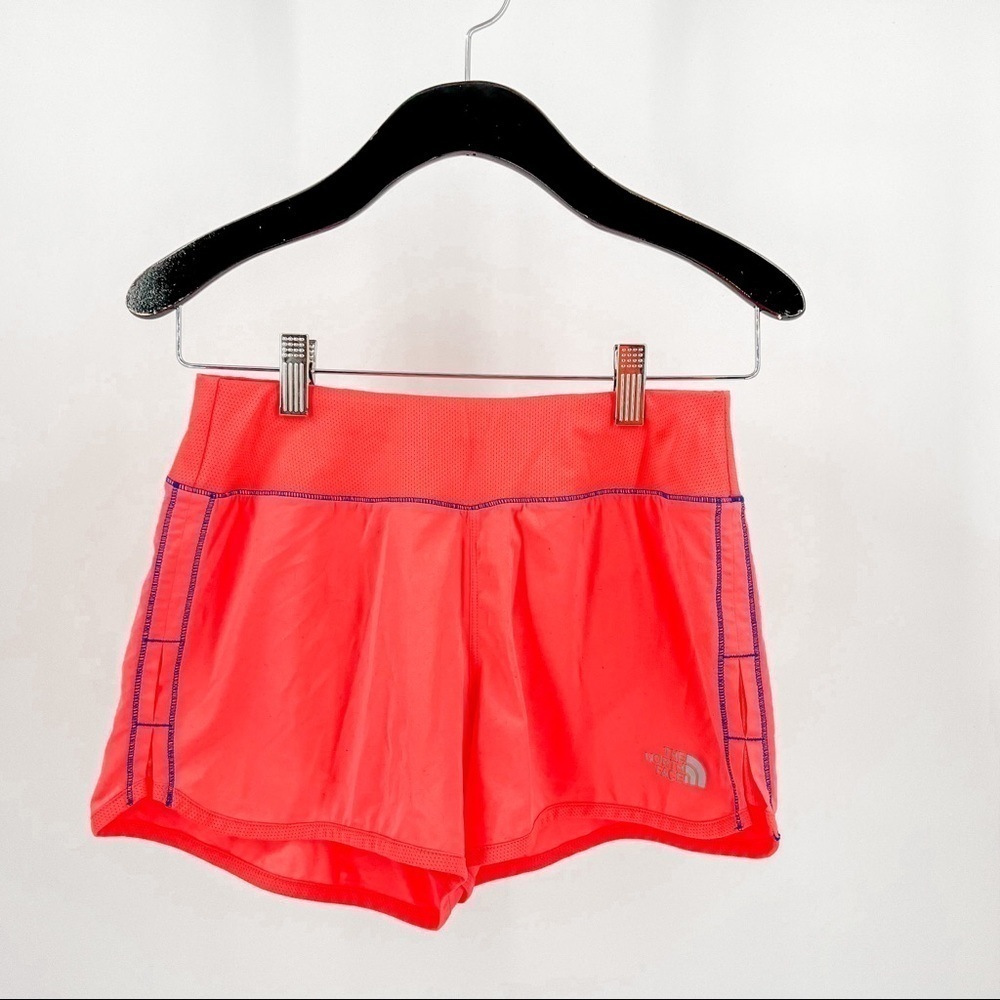 The North Face orange athletic shorts